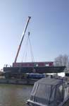 boat being lifted by crane